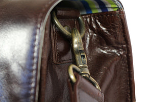 Hill and Ellis Bunbury Classic dark brown Leather Satchel view of leather strap brass attachment for the shoulder strap 