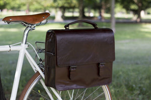 Hill and Ellis Bunbury Classic dark brown Leather Satchel on a white bicycle